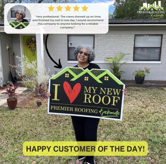 Happy customer with a Premier Roofing sign outside her home